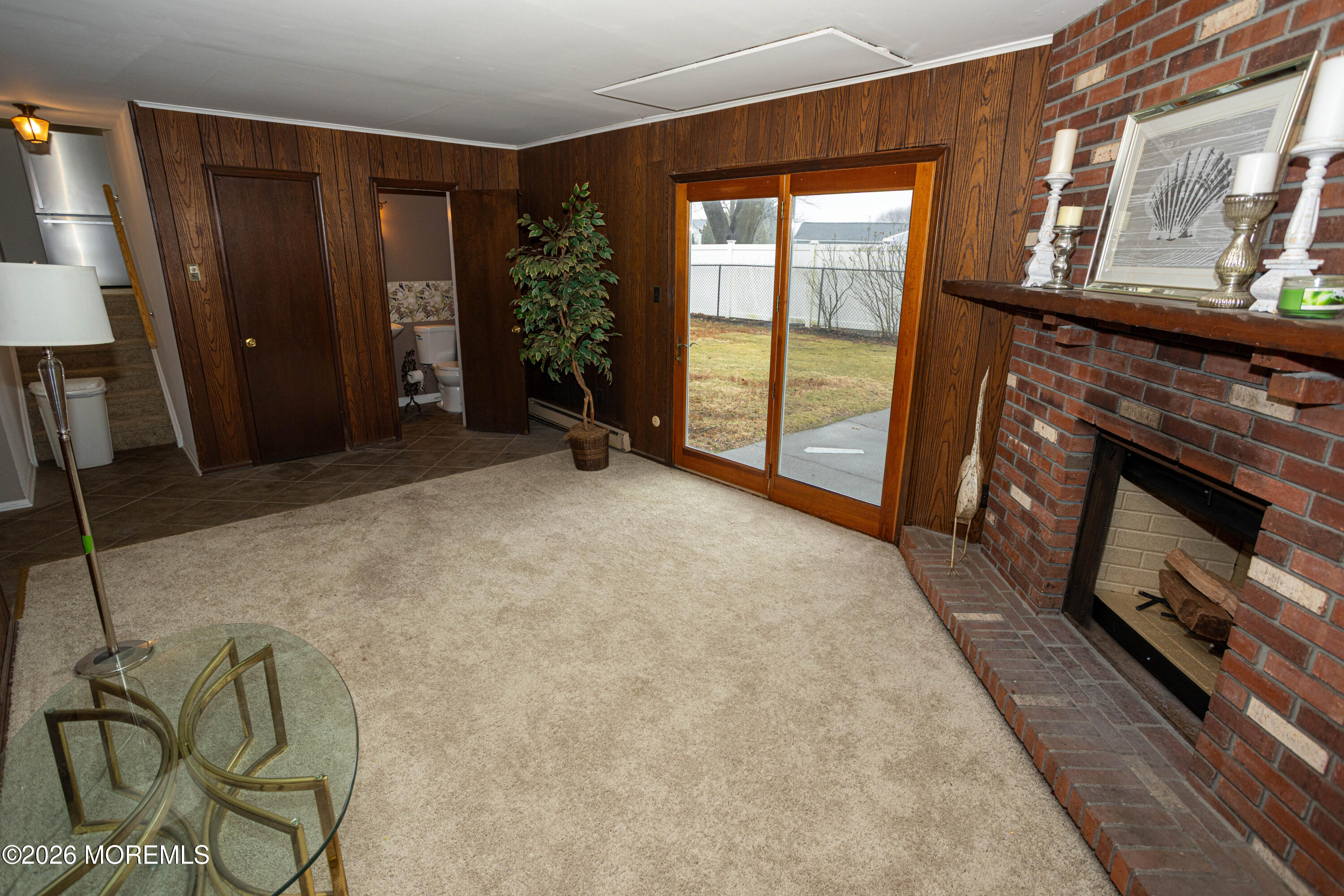 21 Sherwood Road Parlin, NJ 08859 - Photo 22 of 41 an empty room with windows wooden floor and brick wall