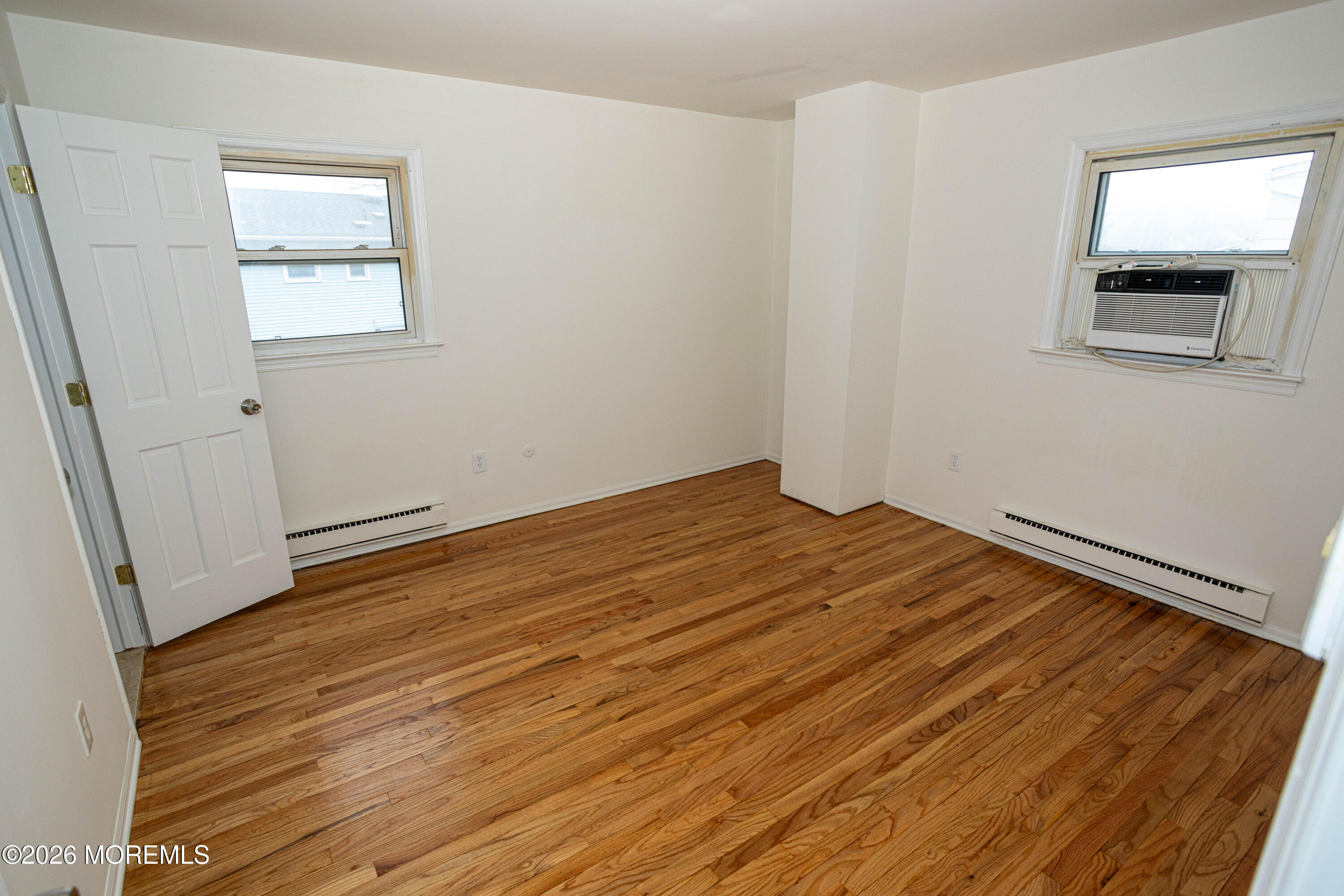 21 Sherwood Road Parlin, NJ 08859 - Photo 29 of 41 a view of empty room with wooden floor and fan