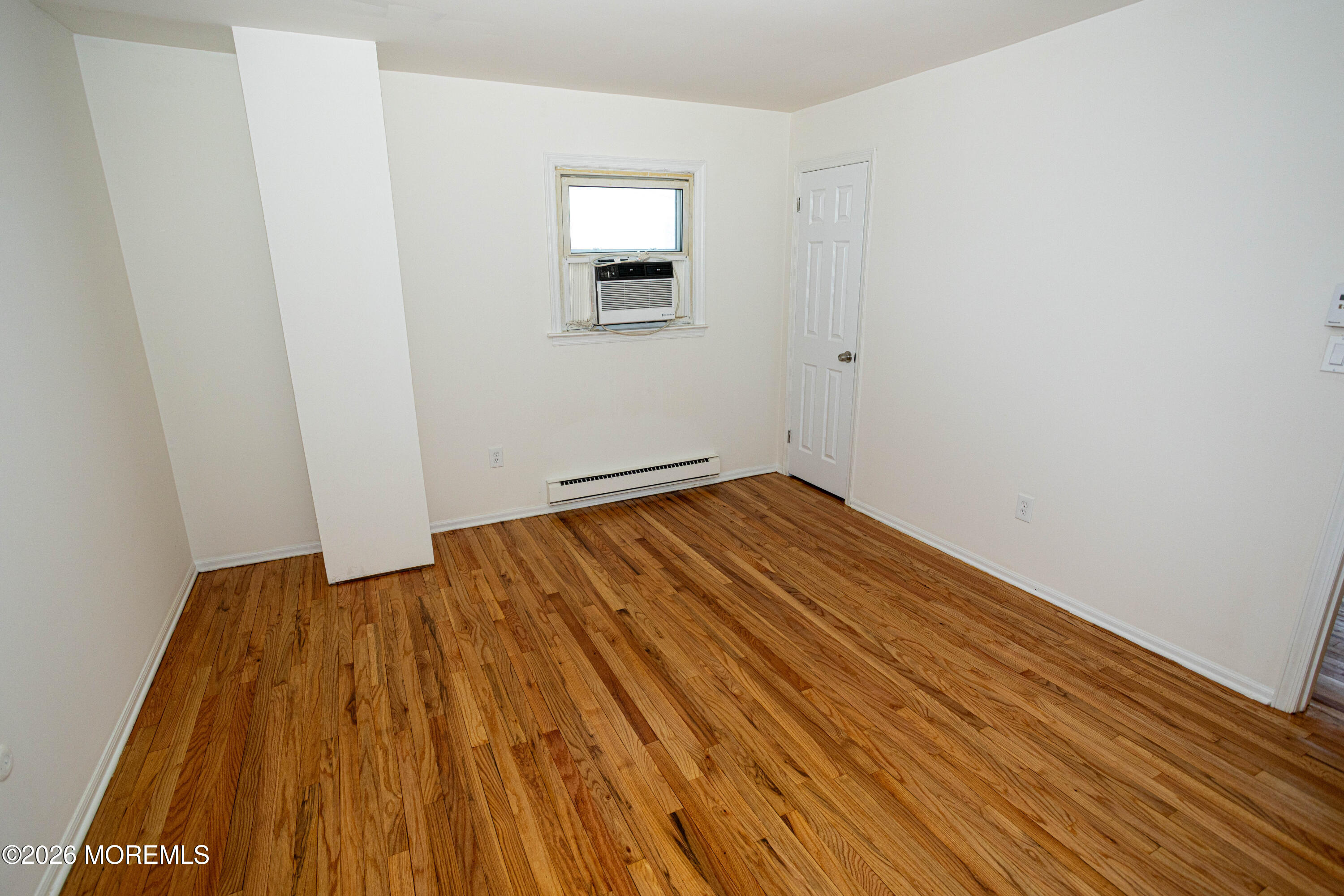 21 Sherwood Road Parlin, NJ 08859 - Photo 30 of 41 a view of a room with wooden floor and white walls