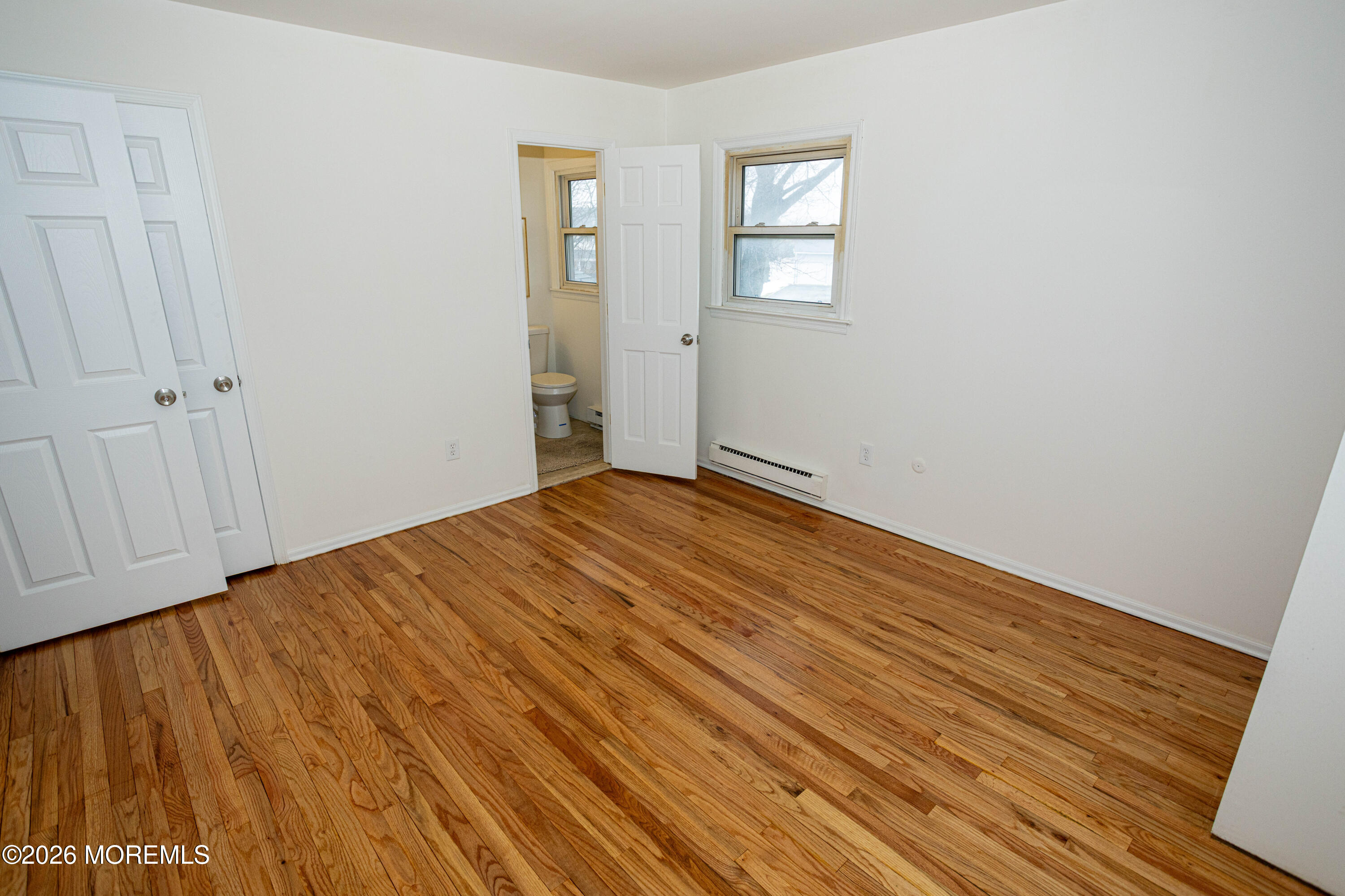 21 Sherwood Road Parlin, NJ 08859 - Photo 31 of 41 a view of empty room with wooden floor and fan
