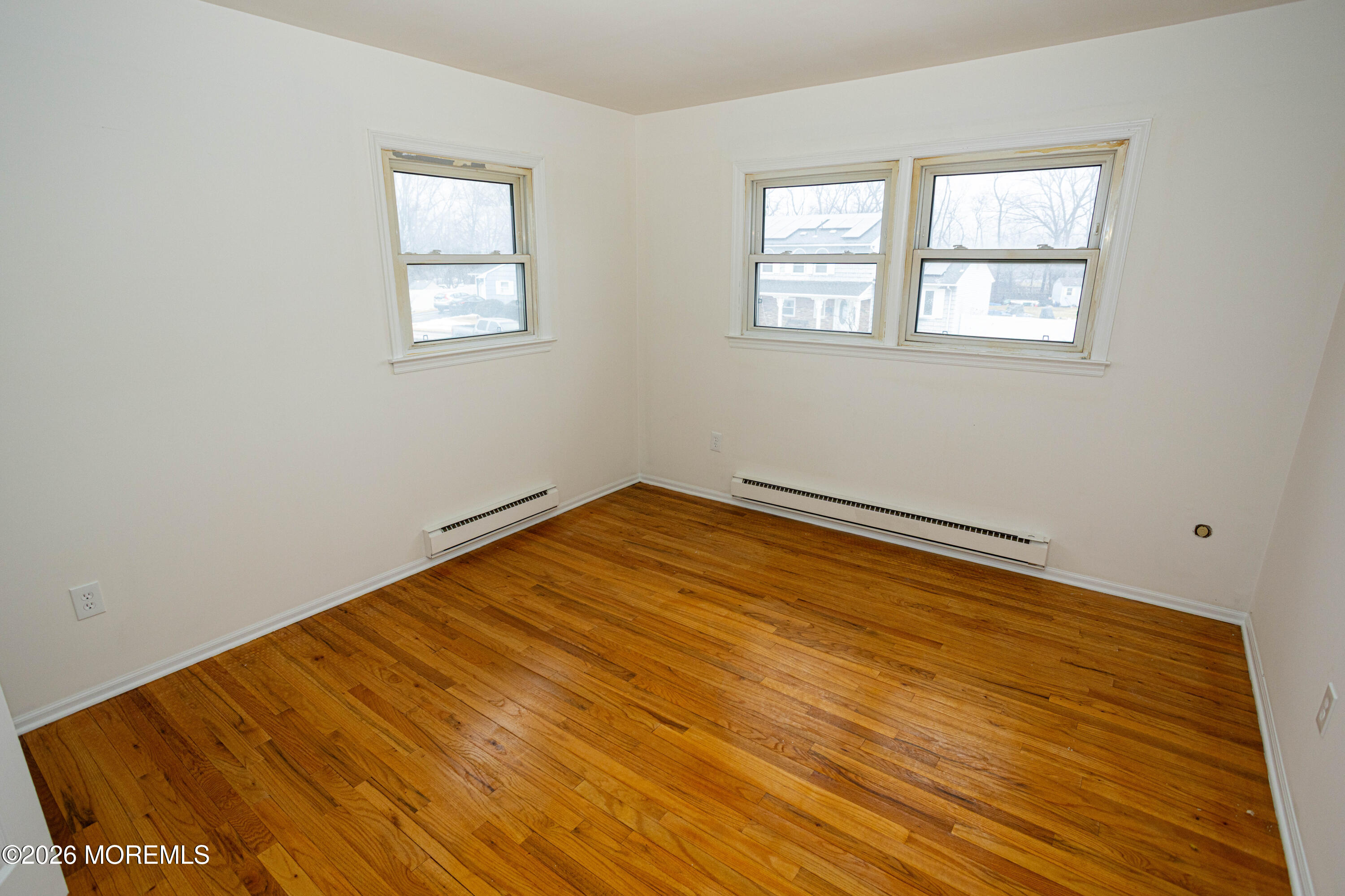 21 Sherwood Road Parlin, NJ 08859 - Photo 33 of 41 a view of a room with wooden floor and windows