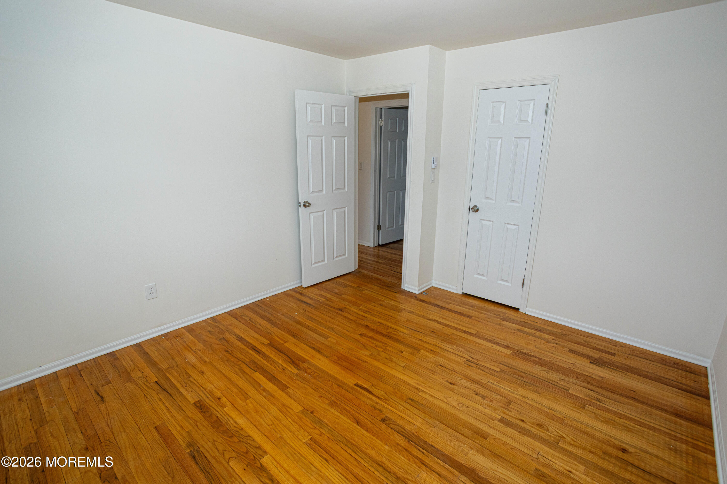 21 Sherwood Road Parlin, NJ 08859 - Photo 35 of 41 a view of empty room with wooden floor