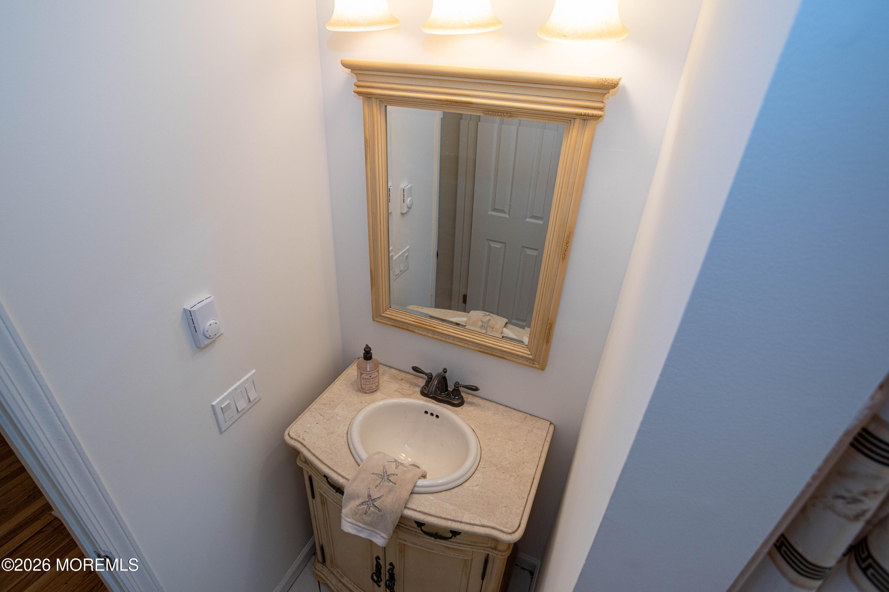21 Sherwood Road Parlin, NJ 08859 - Photo 40 of 41 a bathroom with a sink and a mirror