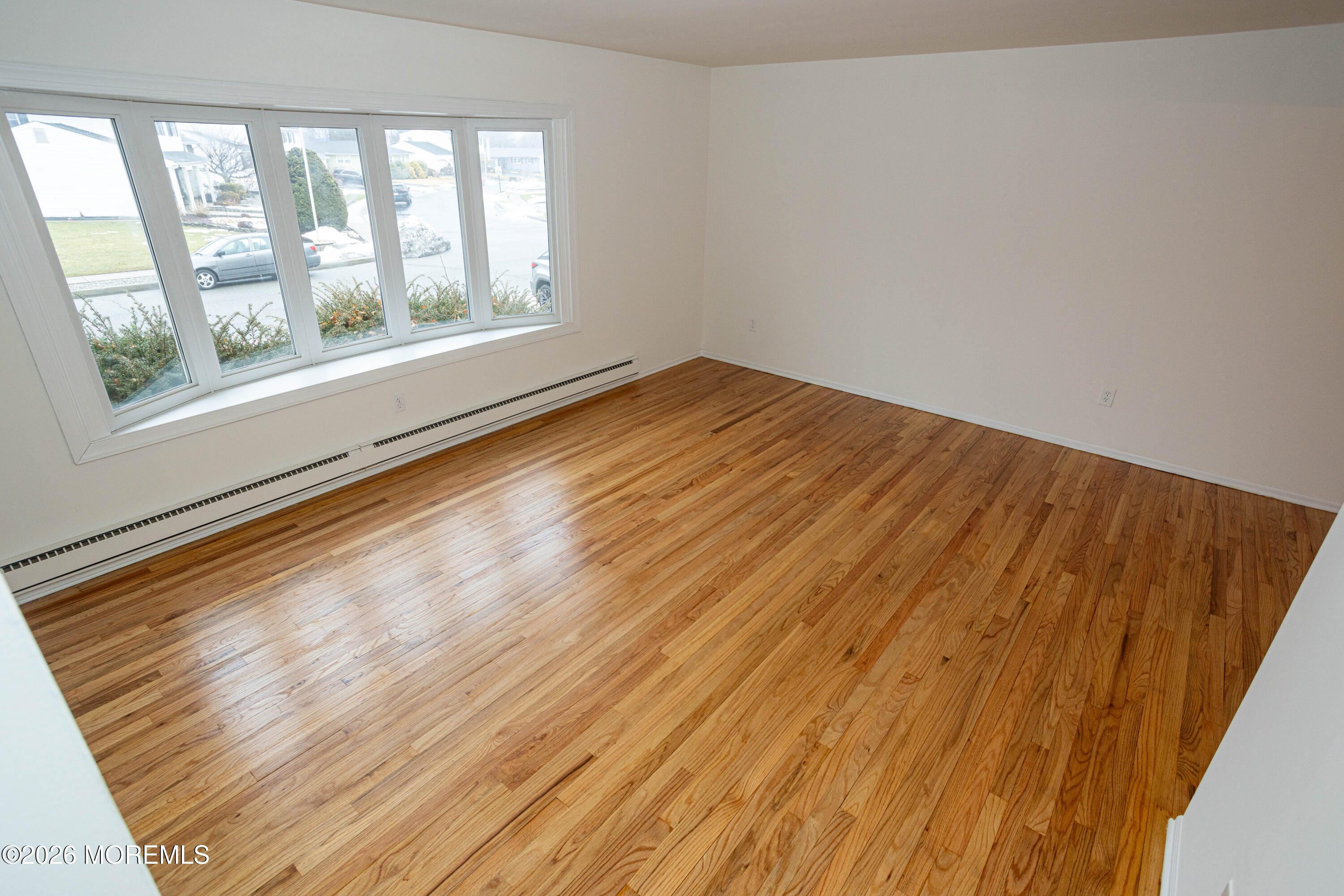 21 Sherwood Road Parlin, NJ 08859 - Photo 10 of 41 an empty room with wooden floor and windows