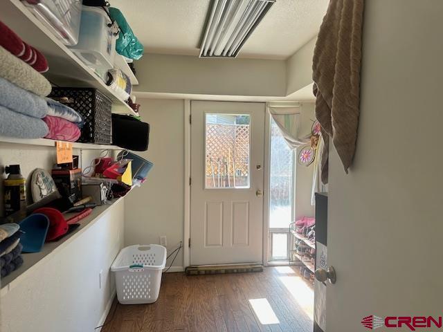 633 Alameda Cortez, CO 81321 - Photo 20 of 23 a view of walk in closet with clothes and shoes