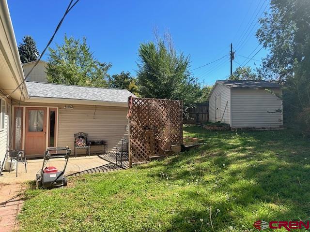 633 Alameda Cortez, CO 81321 - Photo 23 of 23 a backyard of a house with seating space