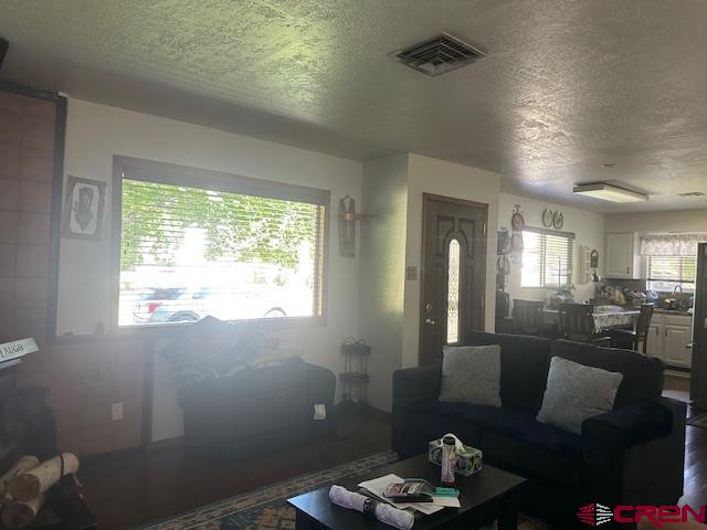 633 Alameda Cortez, CO 81321 - Photo 7 of 23 a living room with furniture and a large window