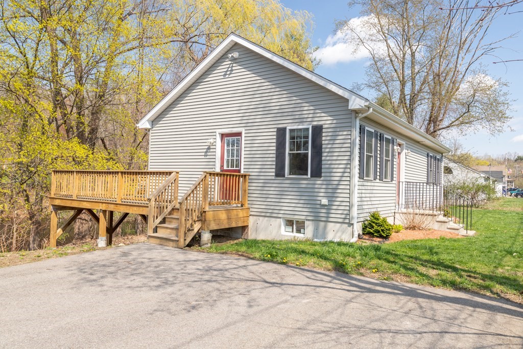 5 Powerstation Road Charlton, MA 01507 - Photo 2 of 21 a view of a house with yard and a garage