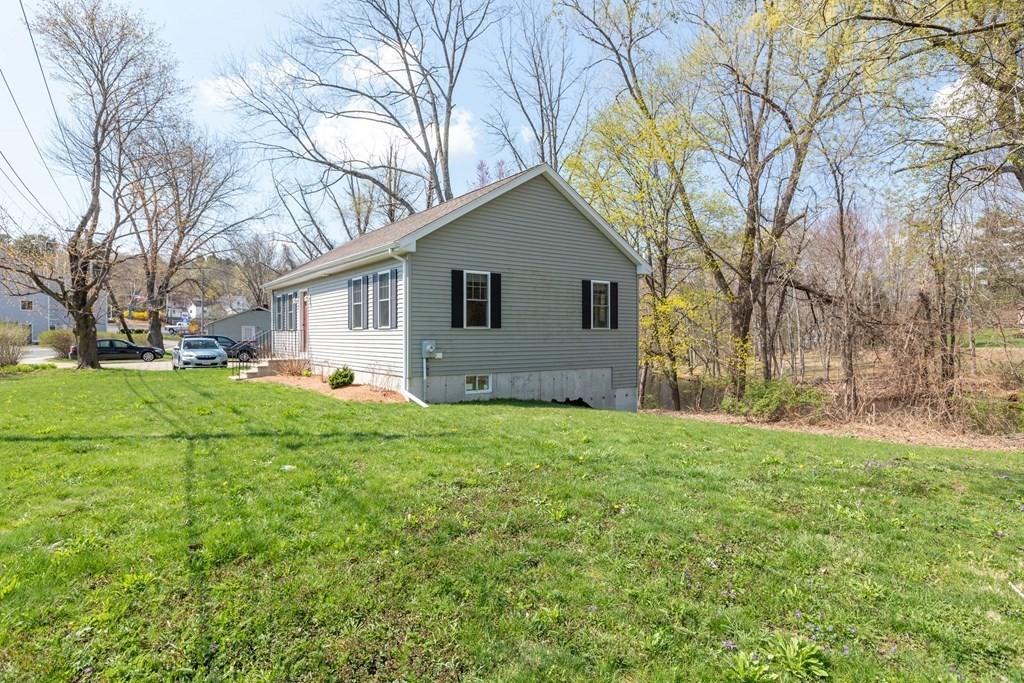5 Powerstation Road Charlton, MA 01507 - Photo 21 of 21 a house is sitting in middle od the grass