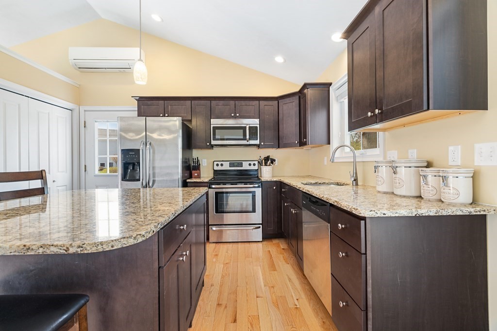 5 Powerstation Road Charlton, MA 01507 - Photo 9 of 21 a kitchen with stainless steel appliances granite countertop a sink a stove and a refrigerator