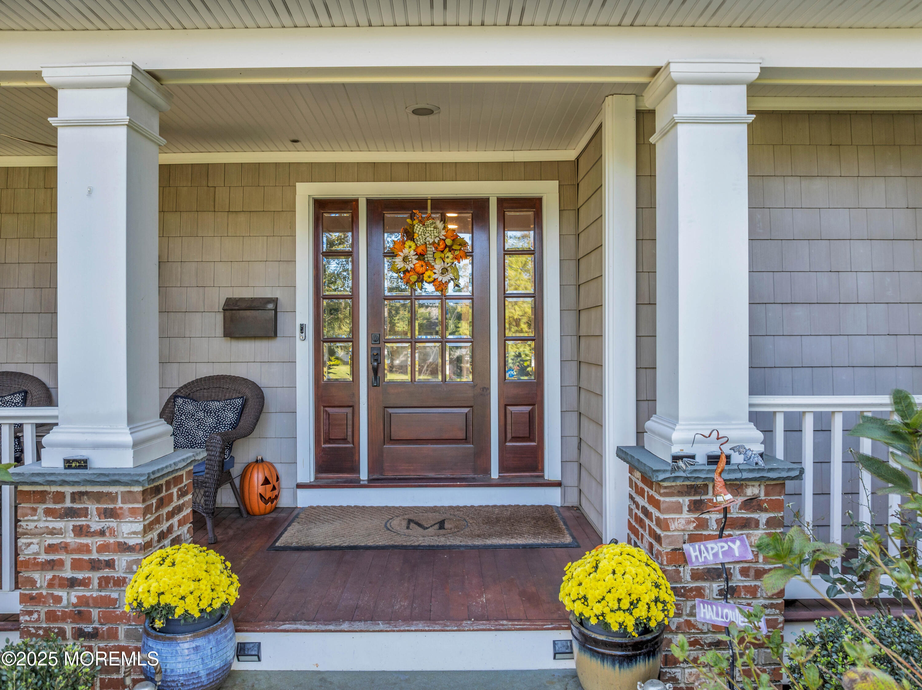 1004 Cedar Lane Brielle, NJ 08730 - Photo 19 of 62 a front view of a house with outdoor seating