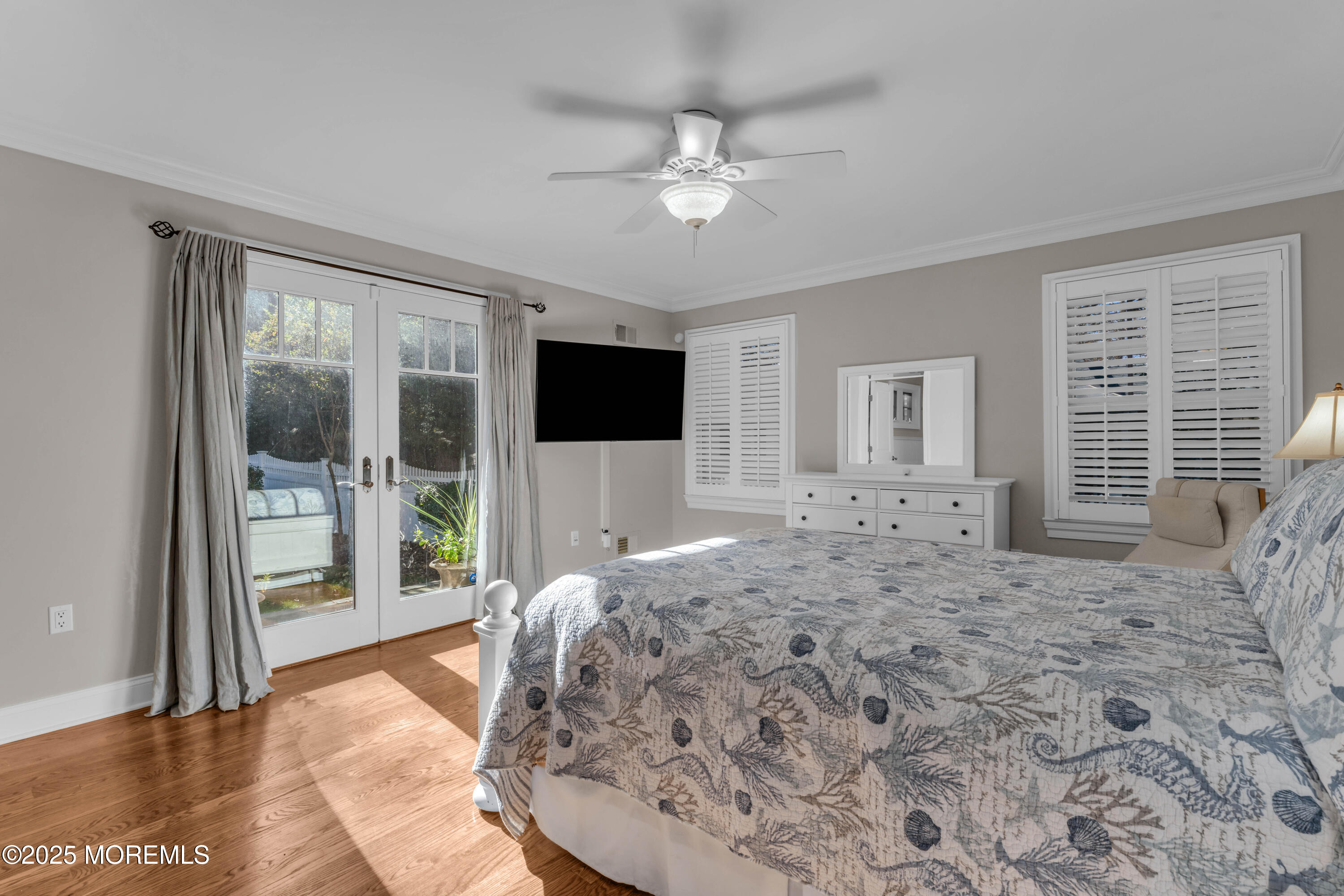 1004 Cedar Lane Brielle, NJ 08730 - Photo 24 of 62 a spacious bedroom with a large bed and a flat screen tv