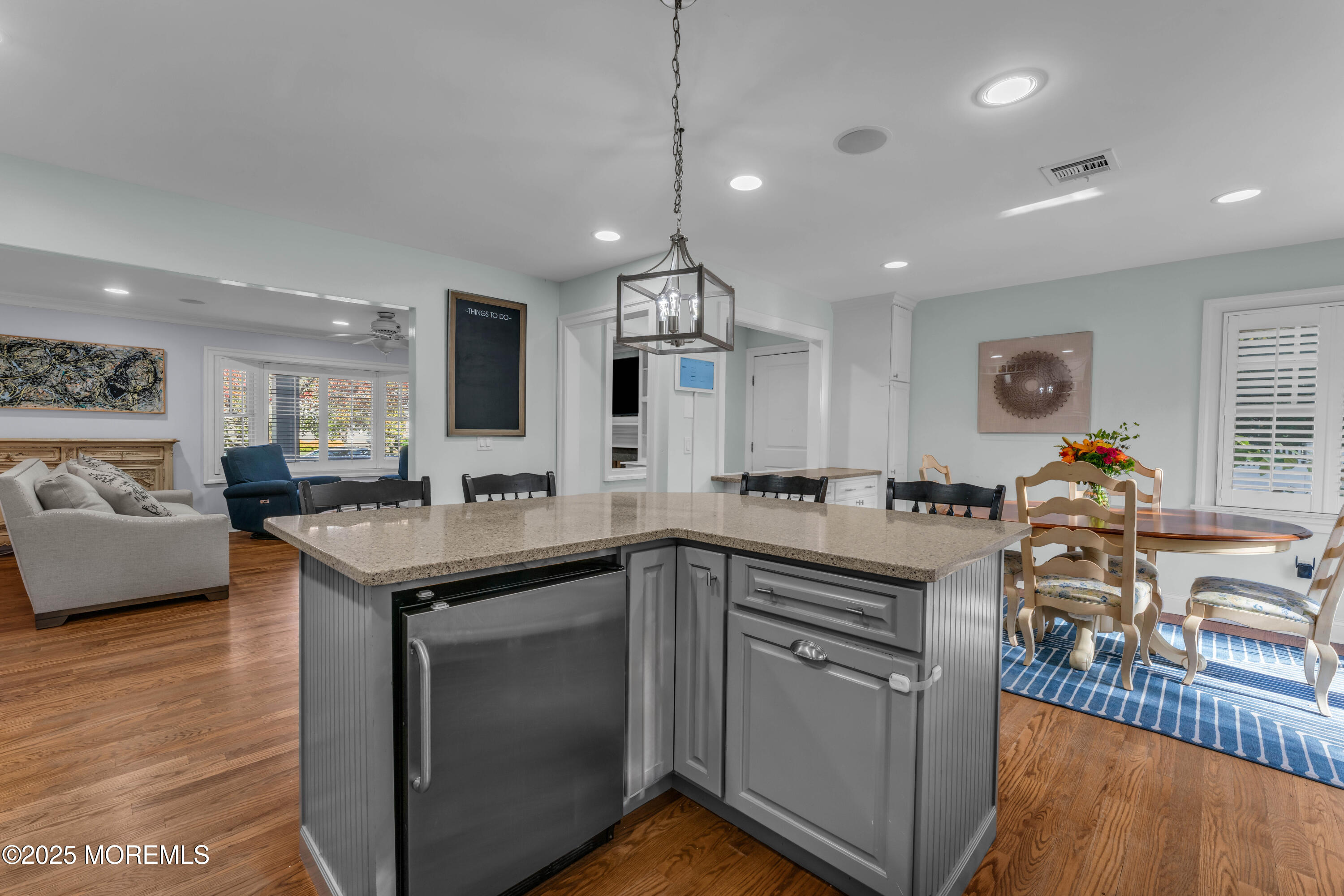 1004 Cedar Lane Brielle, NJ 08730 - Photo 25 of 62 a kitchen with stainless steel appliances granite countertop a sink stove and wooden floor