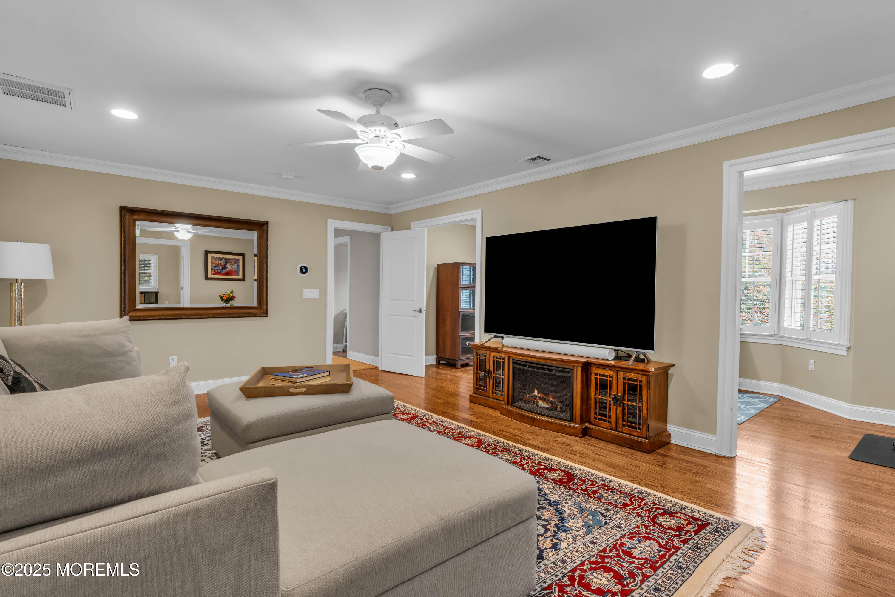 1004 Cedar Lane Brielle, NJ 08730 - Photo 29 of 62 a living room with furniture and a flat screen tv