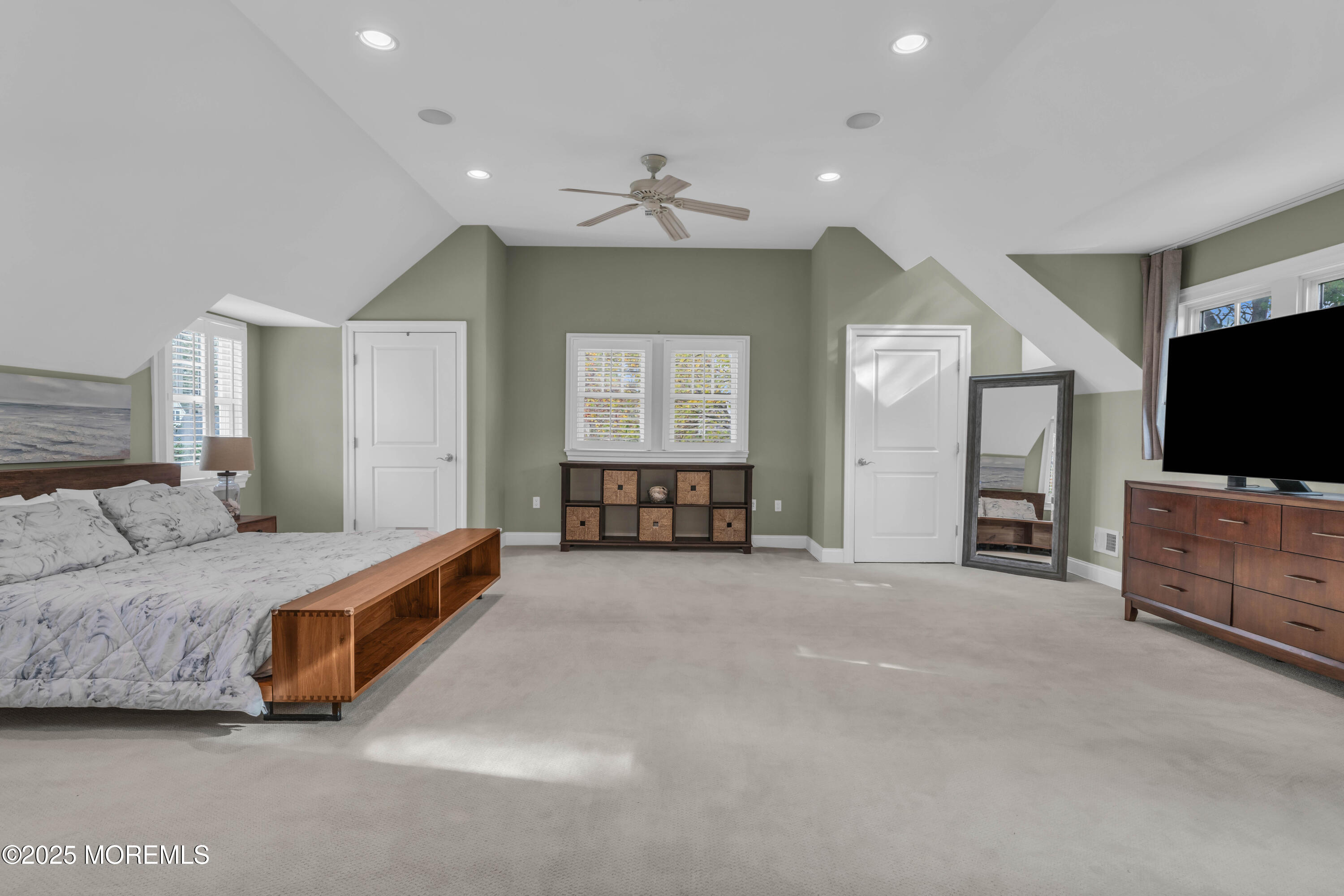 1004 Cedar Lane Brielle, NJ 08730 - Photo 30 of 62 a spacious bedroom with a bed and a flat screen television