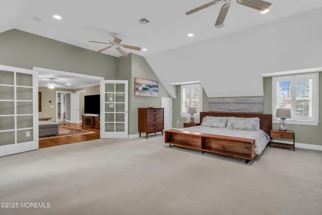 a front view of a house with garden and sitting area