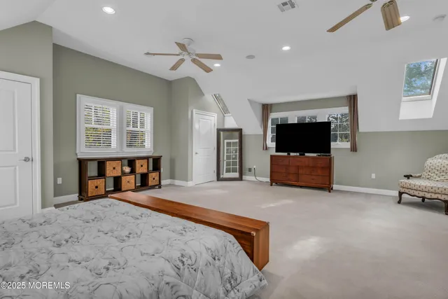 an aerial view of a house with a yard swimming pool and outdoor seating