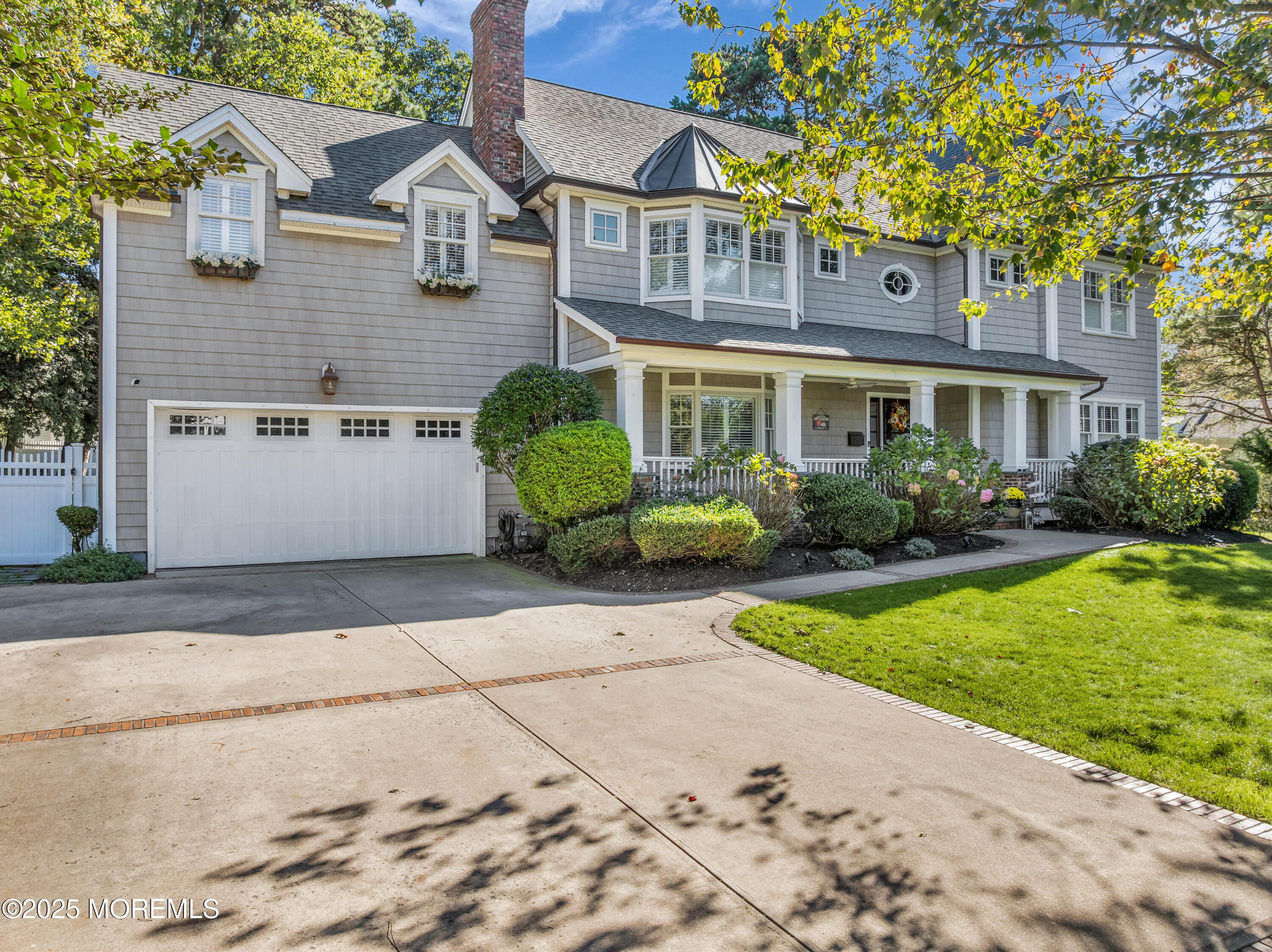 1004 Cedar Lane Brielle, NJ 08730 - Photo 37 of 62 a front view of a house with garden