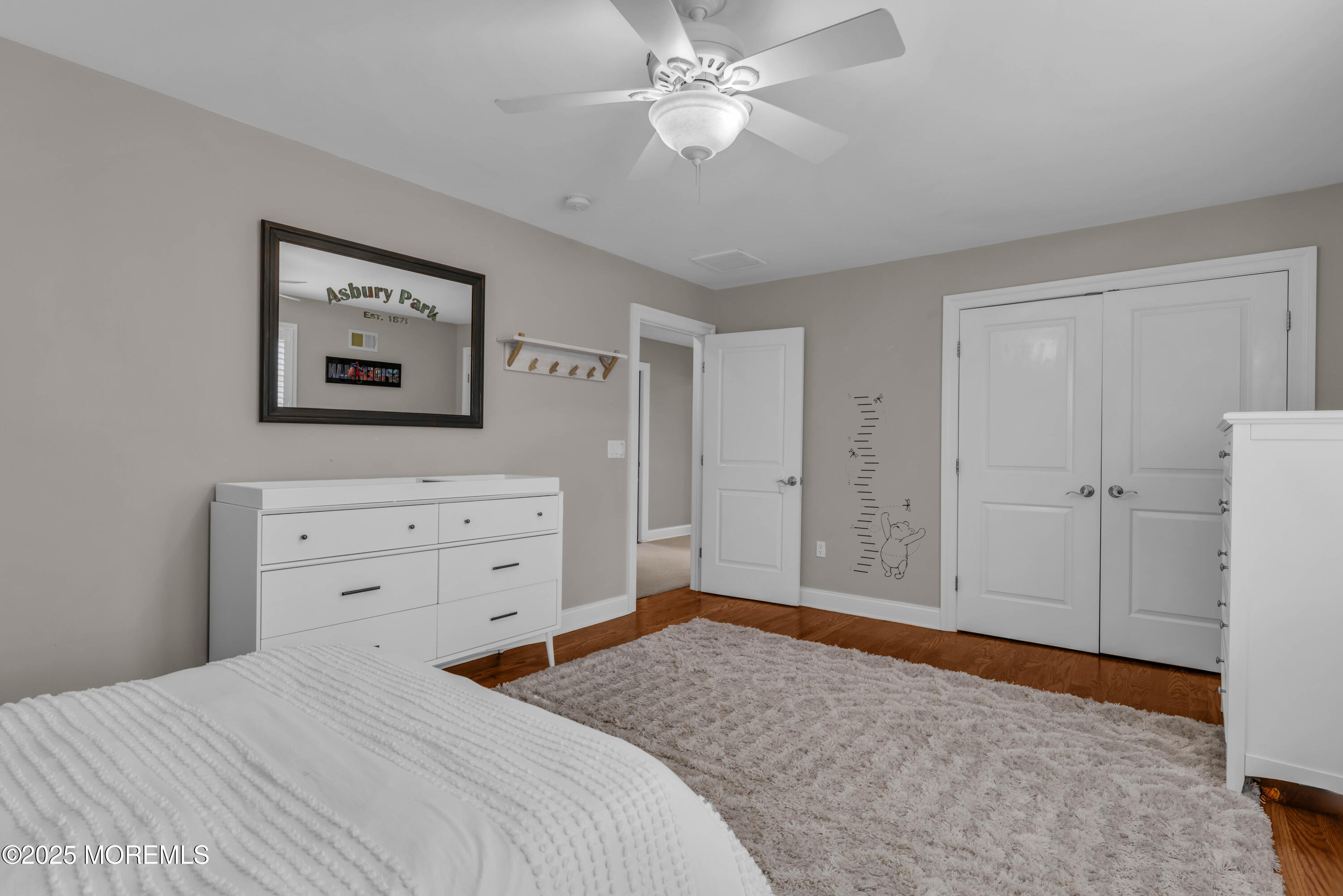 1004 Cedar Lane Brielle, NJ 08730 - Photo 42 of 62 a bedroom with a bed and a dresser