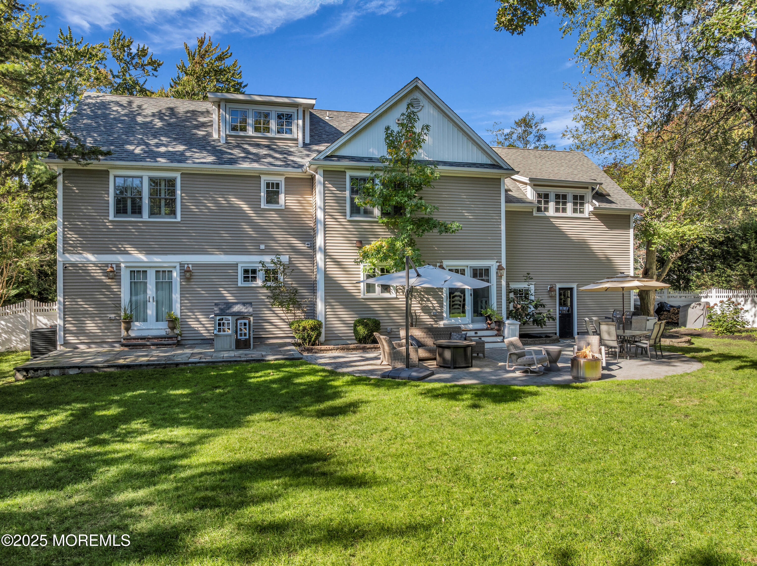 1004 Cedar Lane Brielle, NJ 08730 - Photo 51 of 62 a view of a house with backyard sitting area and swimming pool