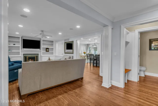 a view of a hallway with workspace and dining room view