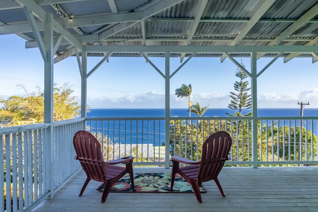 a view of a chair and table in the balcony