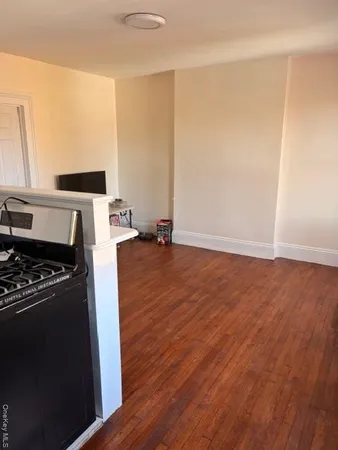 a view of kitchen and wooden floor