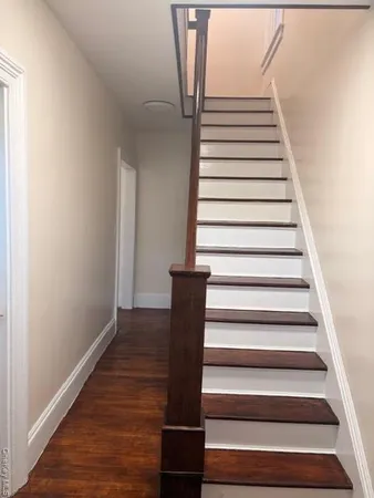 a view of entryway with wooden floor
