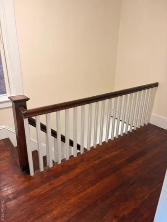 a view of staircase with wooden floor and stairs