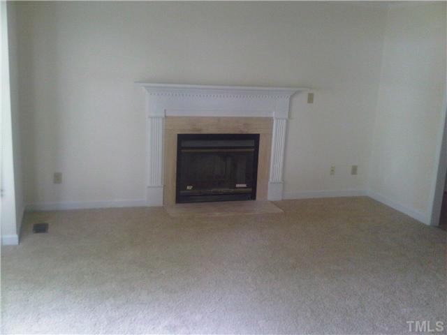 2700 Westhampton Place Raleigh, NC 27604 - Photo 3 of 3 a view of empty room with a fireplace