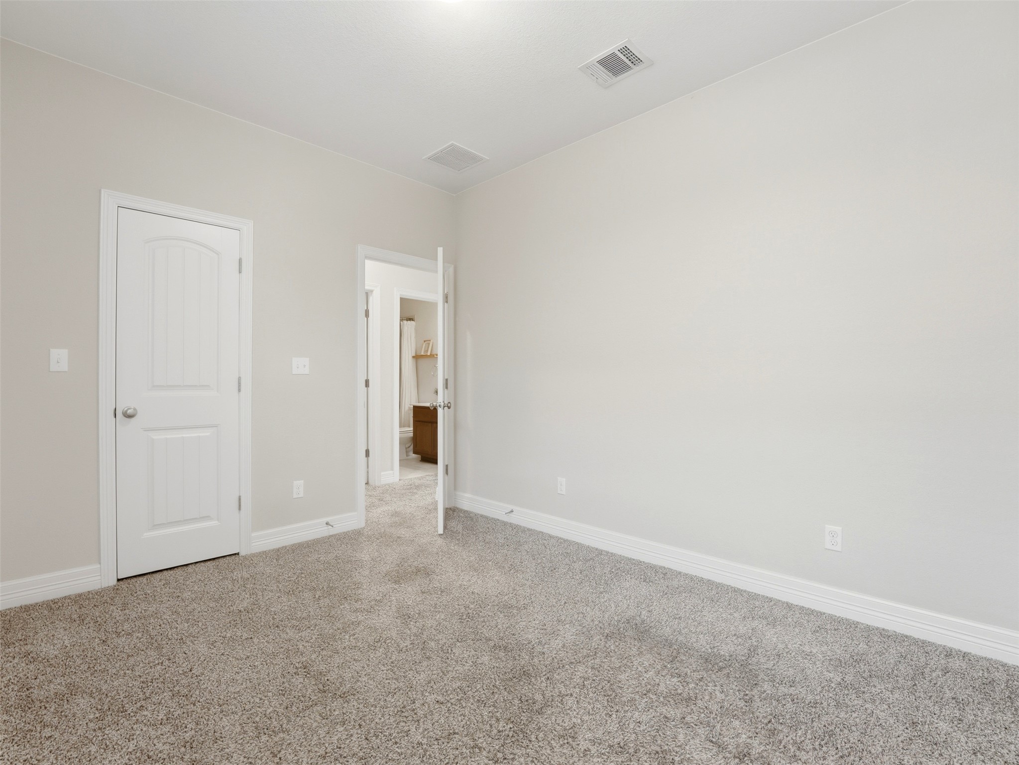 2132 Ringstaff Road Leander, TX 78641 - Photo 31 of 39 A well-lit, neutral-toned room with plush carpeting offers a versatile personal retreat.