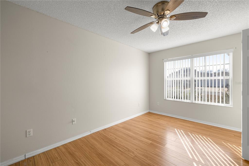8478 Southwest 61st Terrace Road Ocala, FL 34476 - Photo 28 of 39 wooden floor in an empty room with a window