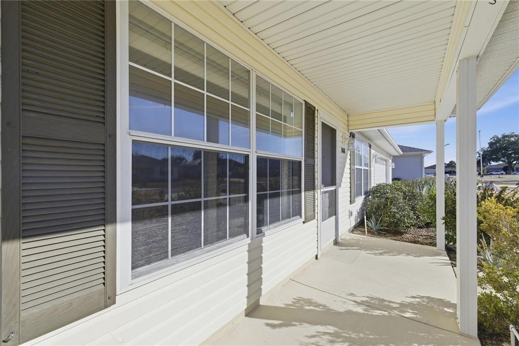 8478 Southwest 61st Terrace Road Ocala, FL 34476 - Photo 3 of 39 a view of a brick house with a large window
