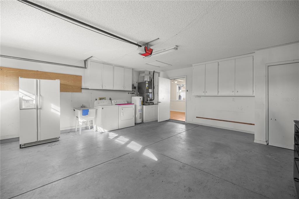 8478 Southwest 61st Terrace Road Ocala, FL 34476 - Photo 31 of 39 a view of a kitchen with refrigerator and a stove top oven