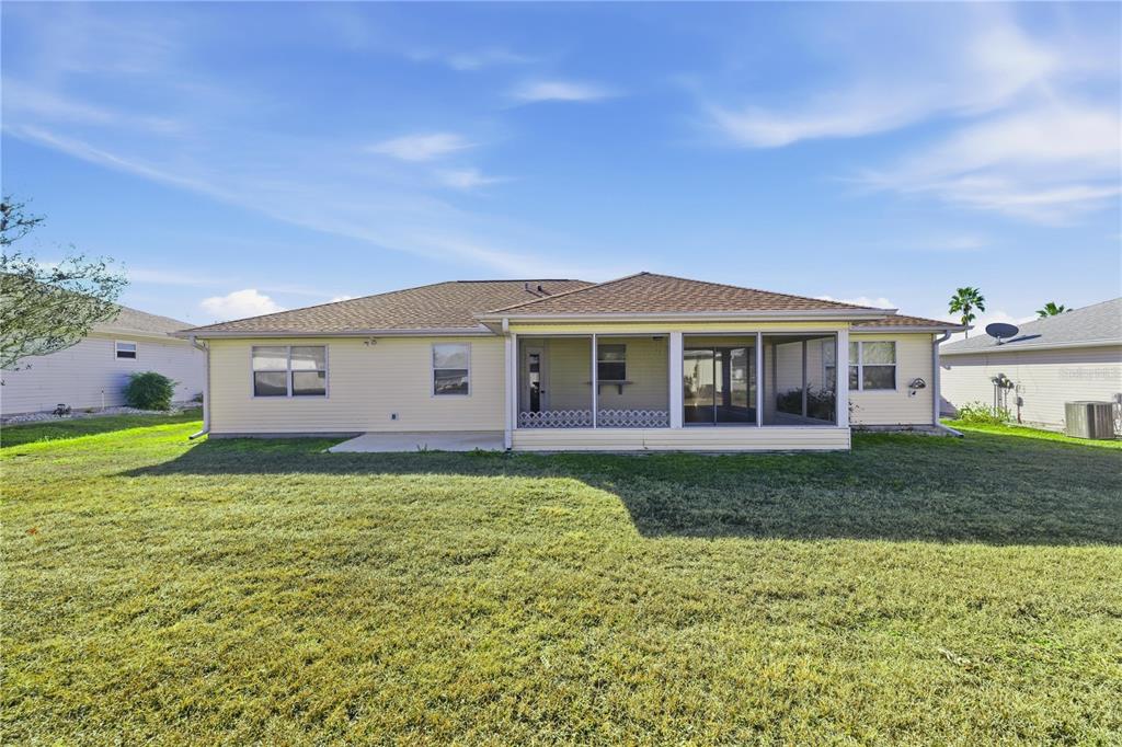 8478 Southwest 61st Terrace Road Ocala, FL 34476 - Photo 38 of 39 a view of a house with a yard