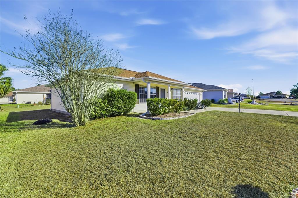 8478 Southwest 61st Terrace Road Ocala, FL 34476 - Photo 5 of 39 a view of a house with a yard