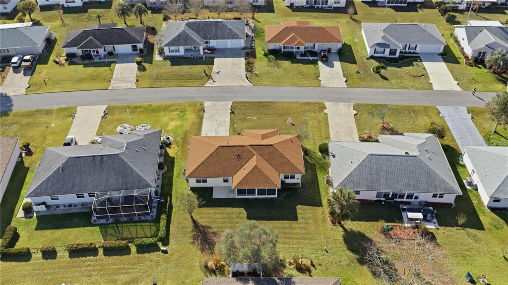 8478 Southwest 61st Terrace Road Ocala, FL 34476 - Photo 7 of 39 a aerial view of a house with a swimming pool