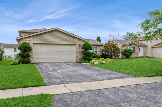 509 Farmview Road University Park, IL 60484 - Photo 1 of 19 a front view of house with yard and green space