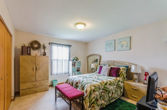 509 Farmview Road University Park, IL 60484 - Photo 15 of 19 a bed room with a bed and a chair