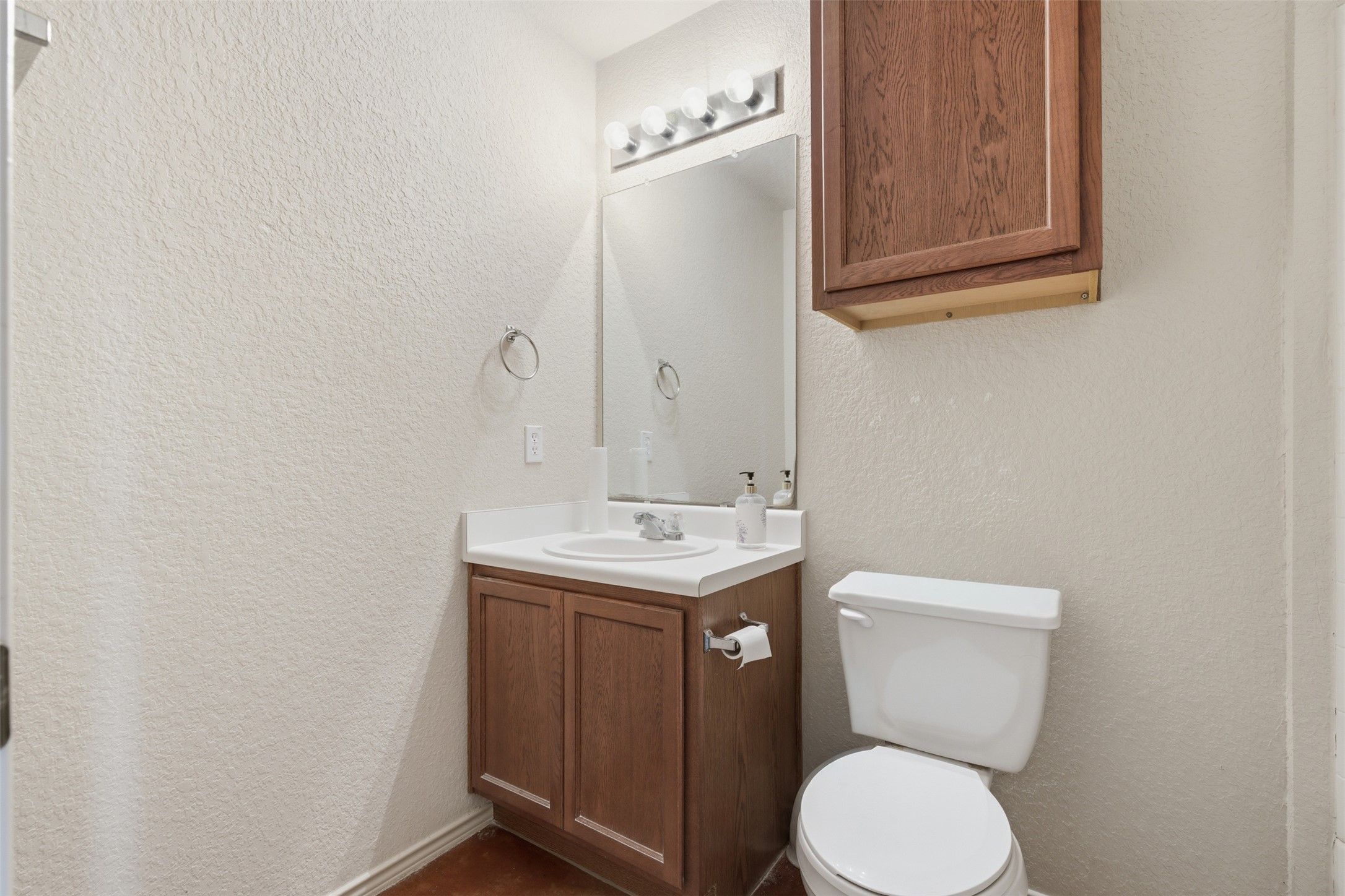 4529 Secure Lane, Unit 31 Austin, TX 78725 - Photo 23 of 38 a bathroom with a toilet a sink and mirror