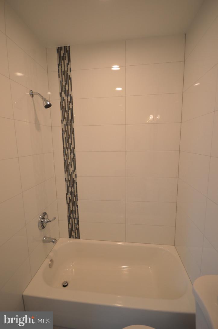 1827 Dudley Street Philadelphia, PA 19145 - Photo 11 of 15 a bathroom with a bathtub and a shower