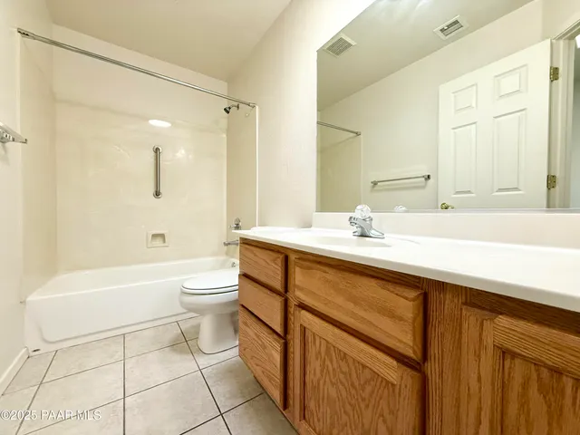 a bathroom with a sink a toilet and a bathtub