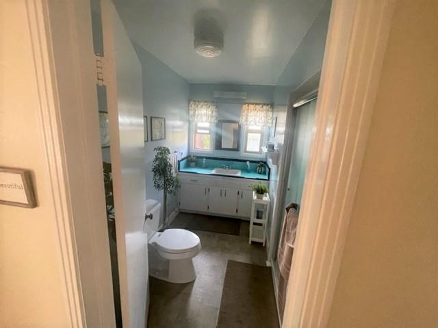 504 Harding Circle Salinas, CA 93906 - Photo 9 of 16 a bathroom with a sink a toilet a mirror and shower