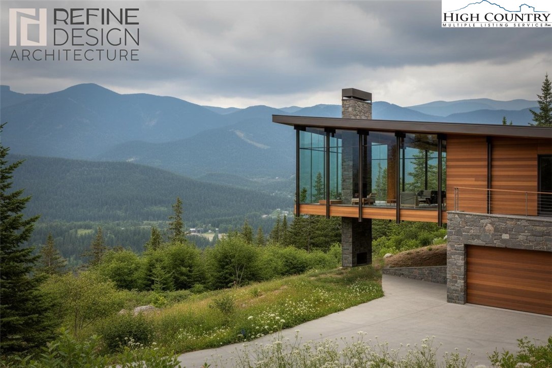 a front view of a house with a yard and mountain view
