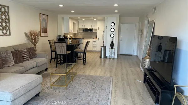 a kitchen with refrigerator and cabinets