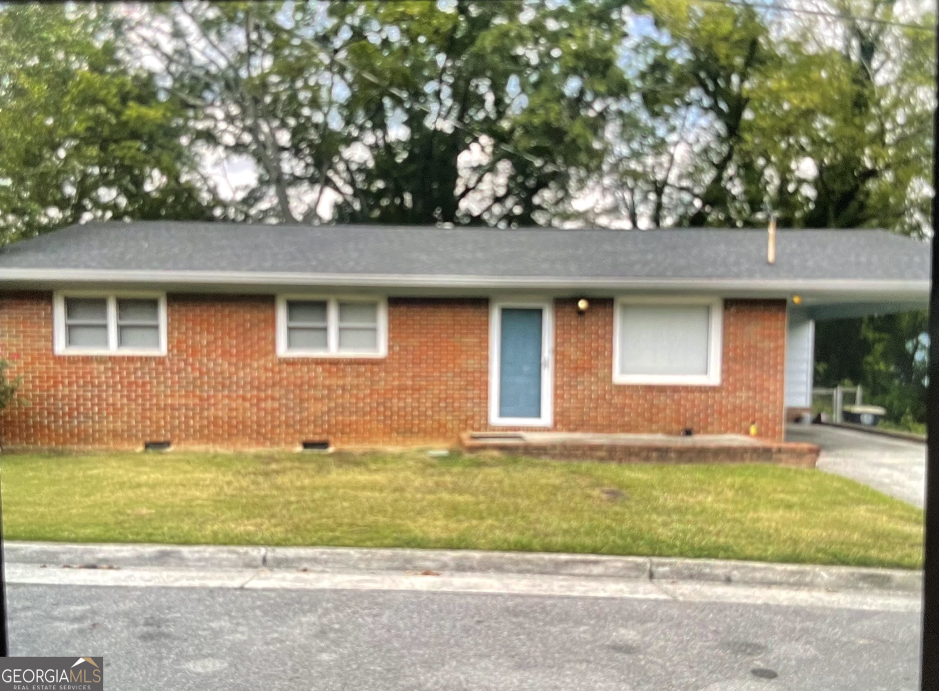505 Brown Street Southwest Rome, GA 30161 - Photo 1 of 1 a front view of a house with a yard