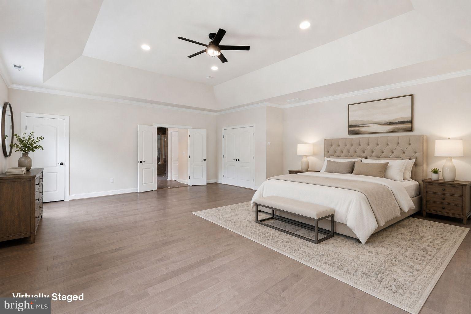 7821 Old Falls Road McLean, VA 22102 - Photo 26 of 62 a spacious bedroom with a bed and a chandelier