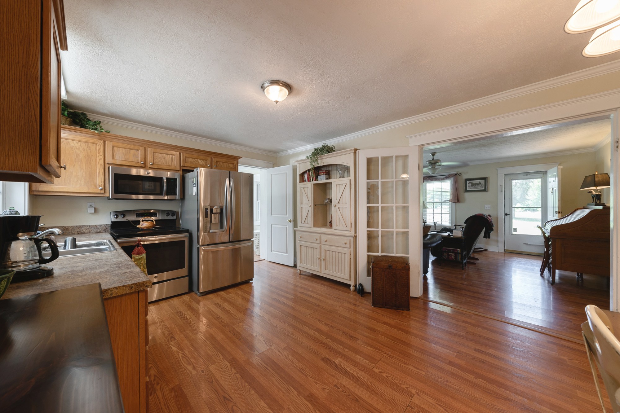 2446 Warner Bridge Road Shelbyville, TN 37160 - Photo 11 of 42 a kitchen with a refrigerator and a stove top oven