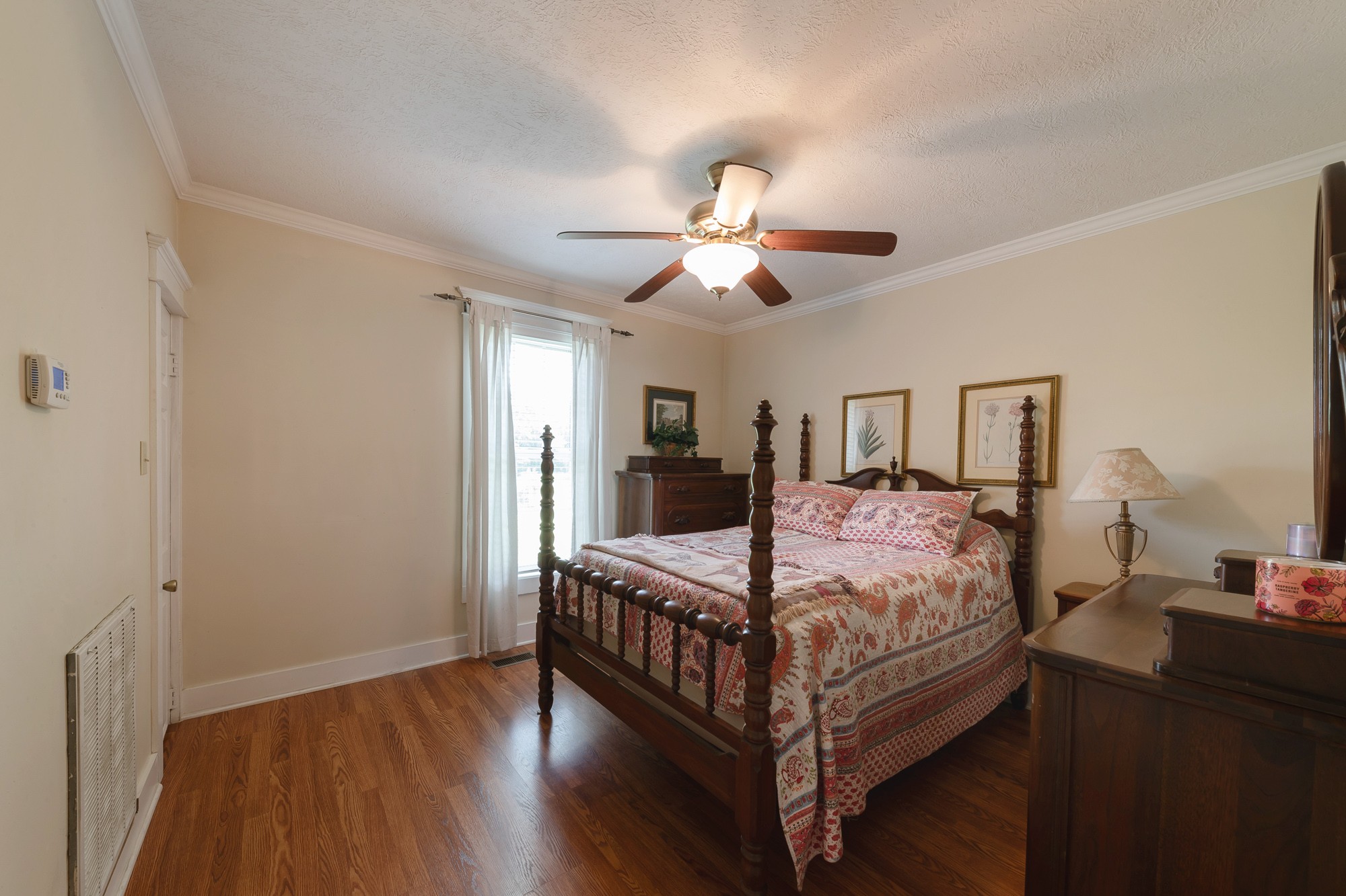 2446 Warner Bridge Road Shelbyville, TN 37160 - Photo 17 of 42 a bedroom with a bed and a chandelier
