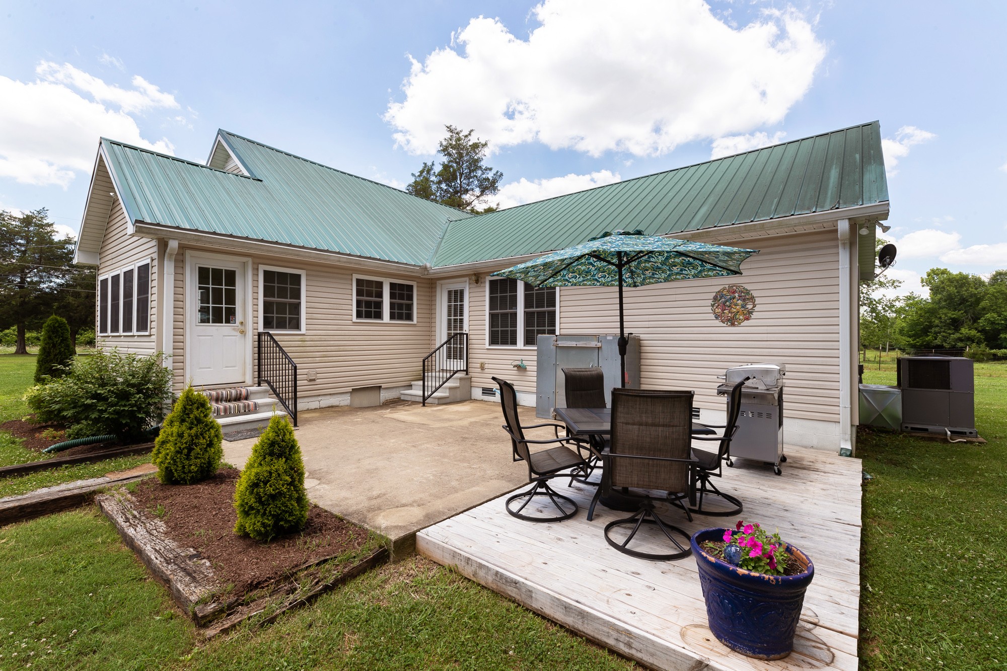 2446 Warner Bridge Road Shelbyville, TN 37160 - Photo 3 of 42 a view of a dinning table and chairs in patio
